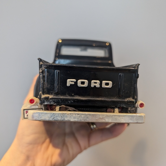 Classic Black Toy Truck with Red Wheels - Picture 11 of 11